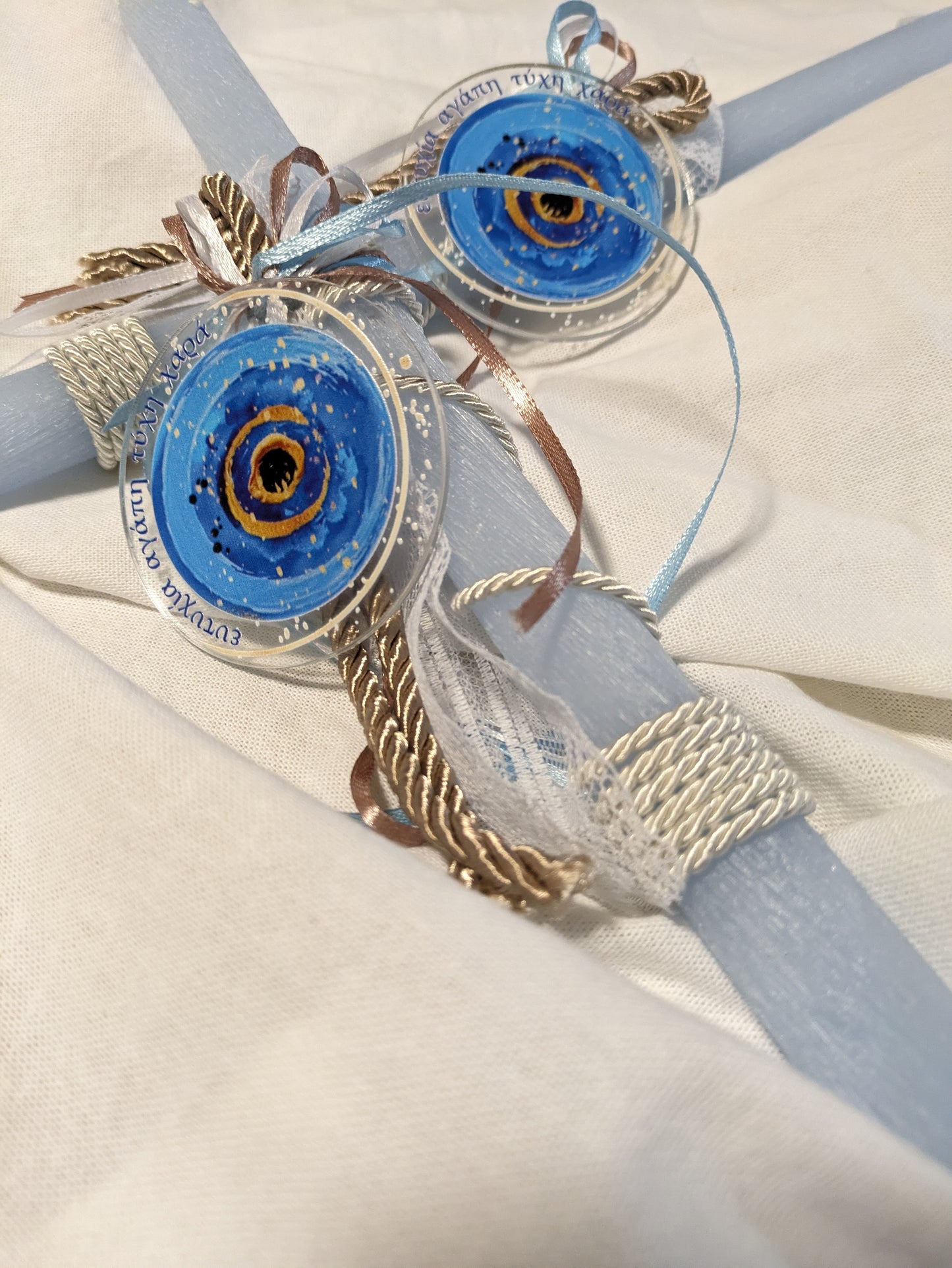 Well Wishes round Mati Magnet on blue Candle